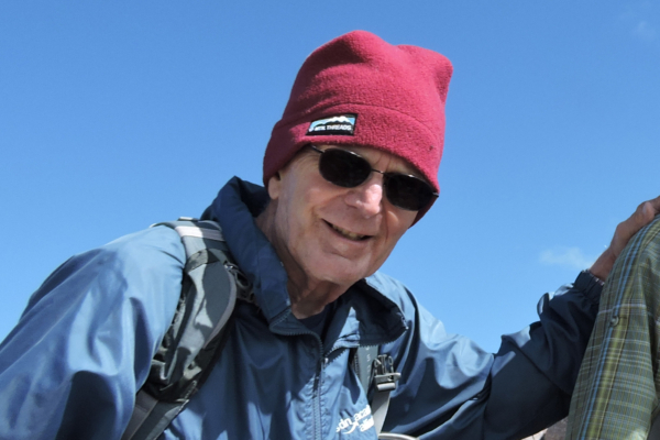 Ralph Hilzer stands at the top of Mount Lassen.