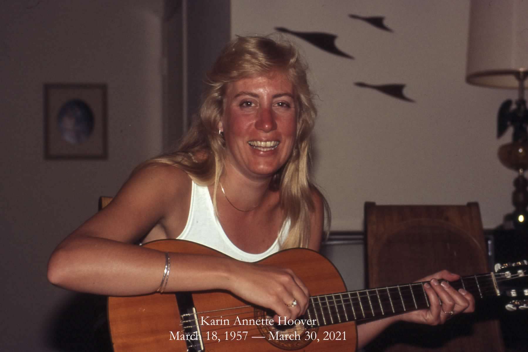 Karin Hoover plays a guitar.