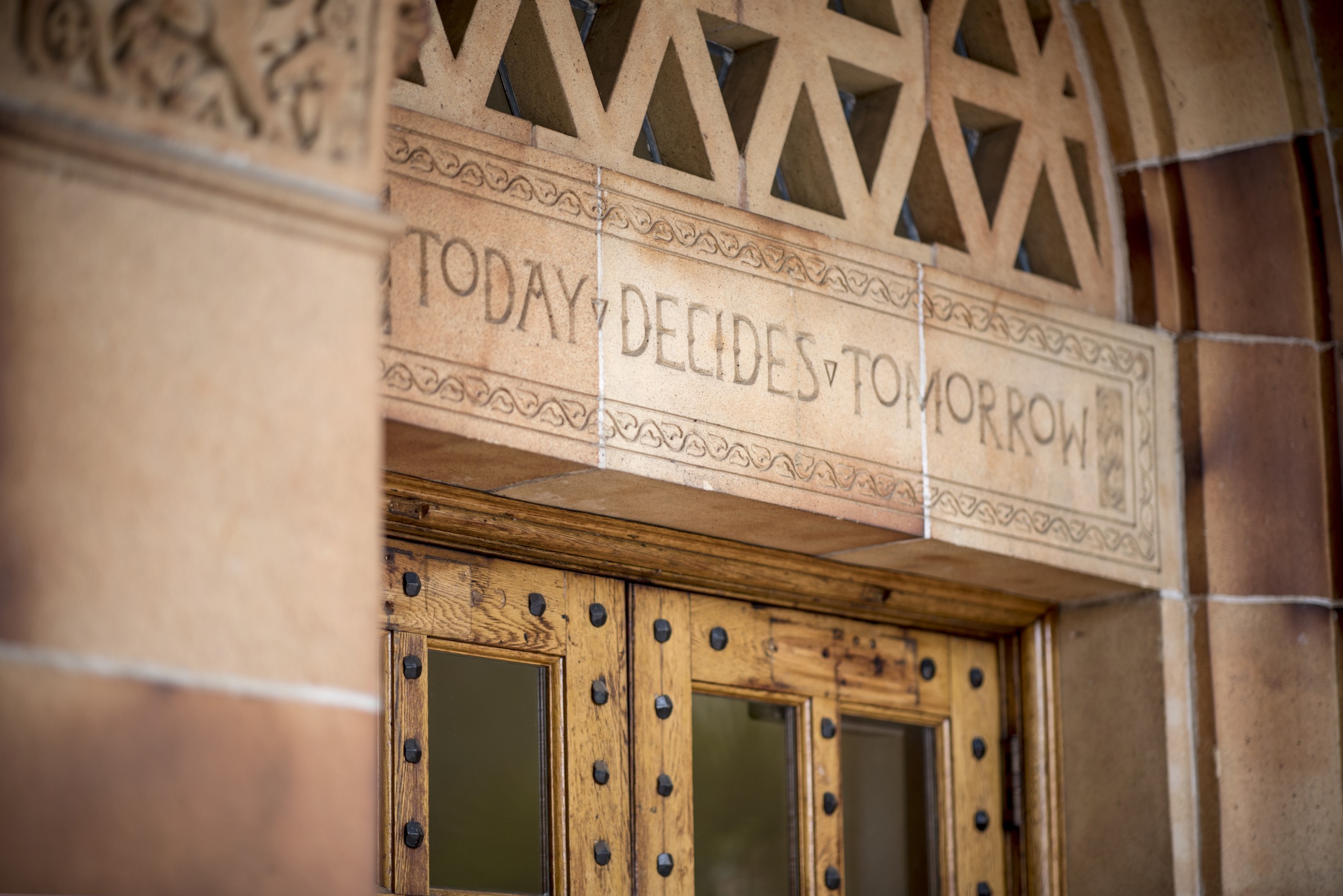 "Today Decides Tomorrow" is read on the Kendall Hall building