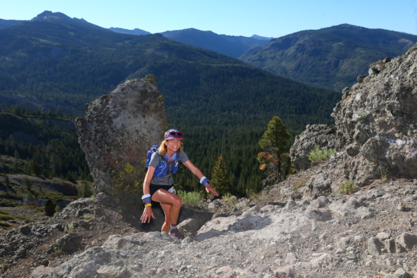 Debbie Booth crests a hill as she runs in the Western States Endurance Race.