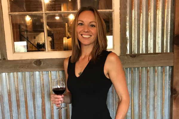 Winemaker Vanessa Pitney holds a glass of wine at her winery.