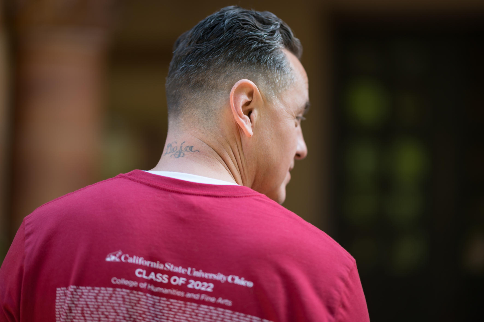 The name "Deja" is seen tattooed on the back of Benny Gutierrez's neck.