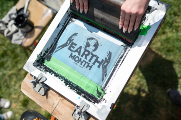 A screenprint of a logo that says "Earth Month"