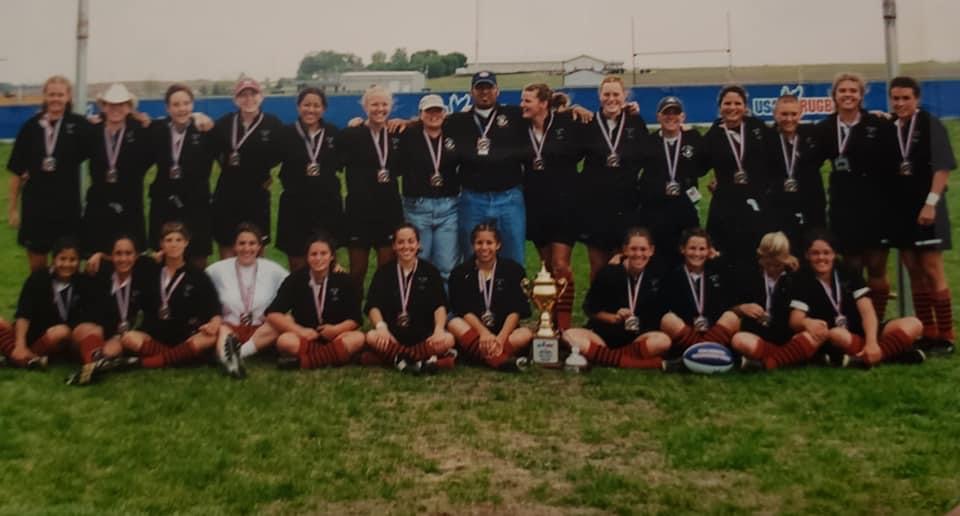 Chico State's 2001 National Championship Women's Rugby Team pose and smile