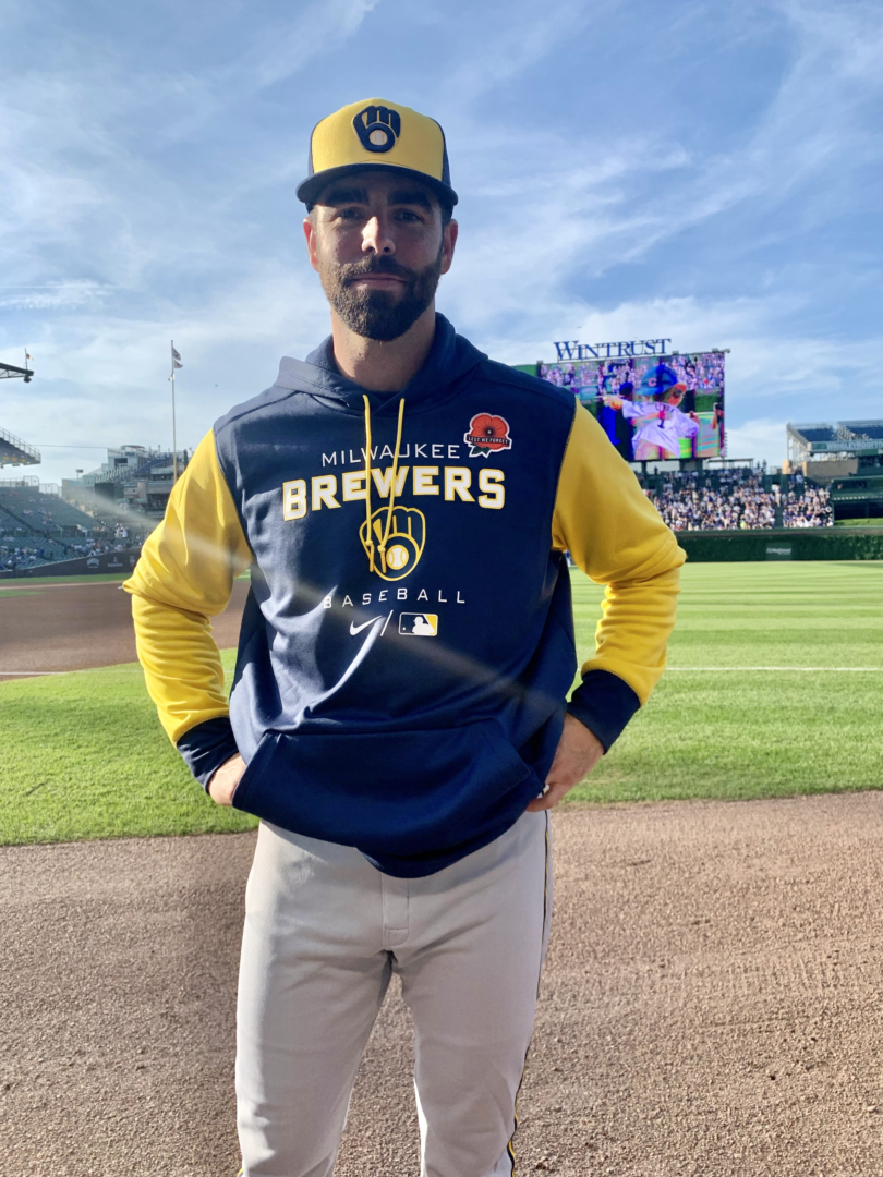 Luke Barker wearing his Milwaukee Brewers uniform standing in Wrigley Field