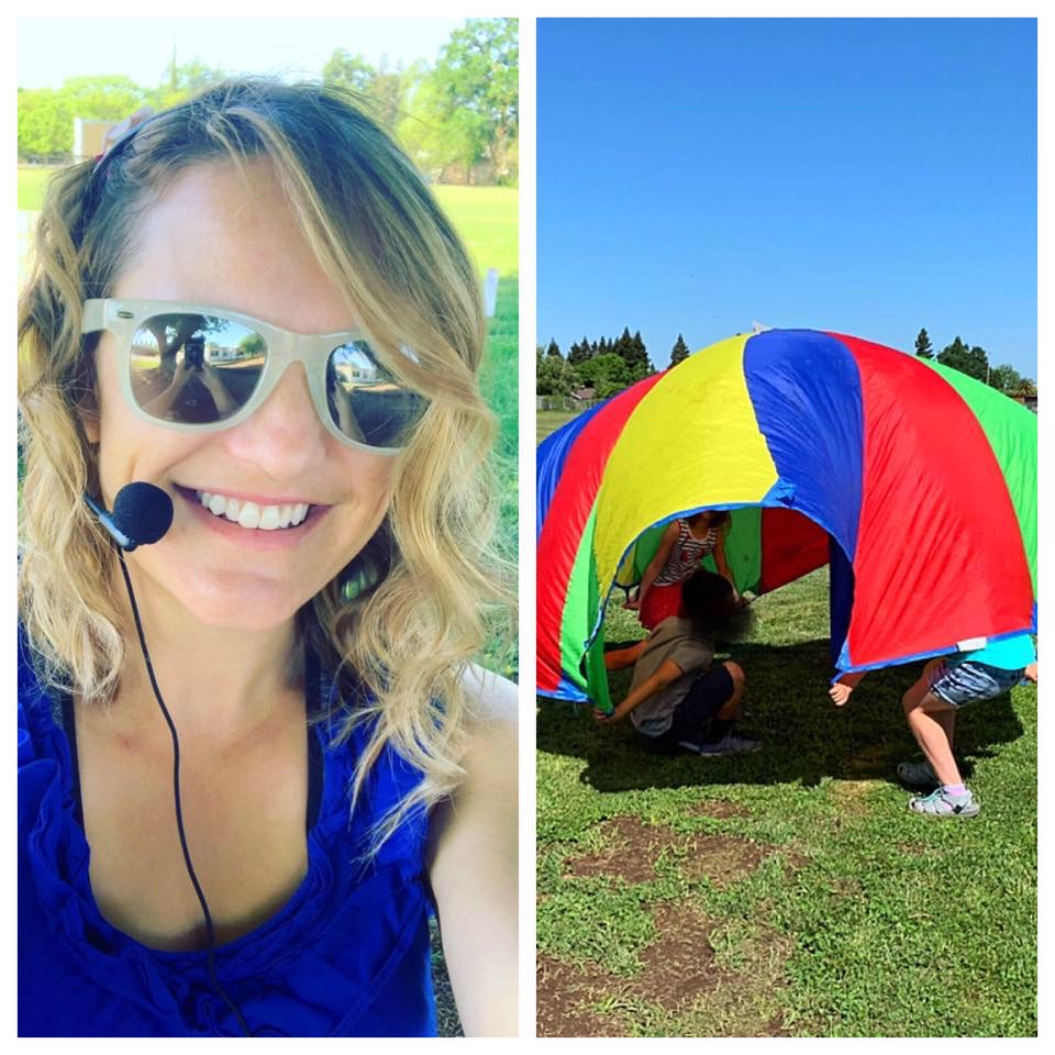 In a split screen, a young adult woman teacher takes a selfie on the left, and on the right a group of children play under a rainbow-colored parachute