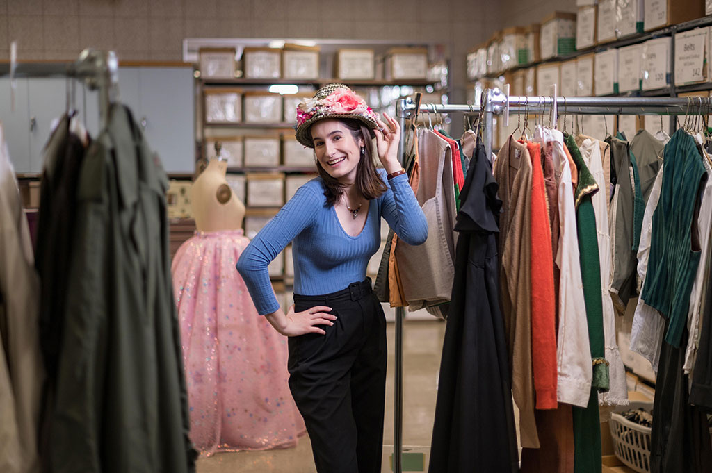 Gaby Saxon poses in the costume shop, where she works.