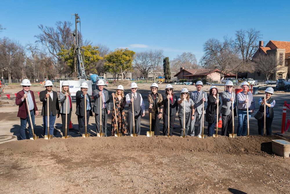 University representatives wear hard hats and turn dirt with shovels as the campus community gathered for the groundbreaking ceremony for the new College of BSS Building in the footprint of the old Physical Sciences Building. 