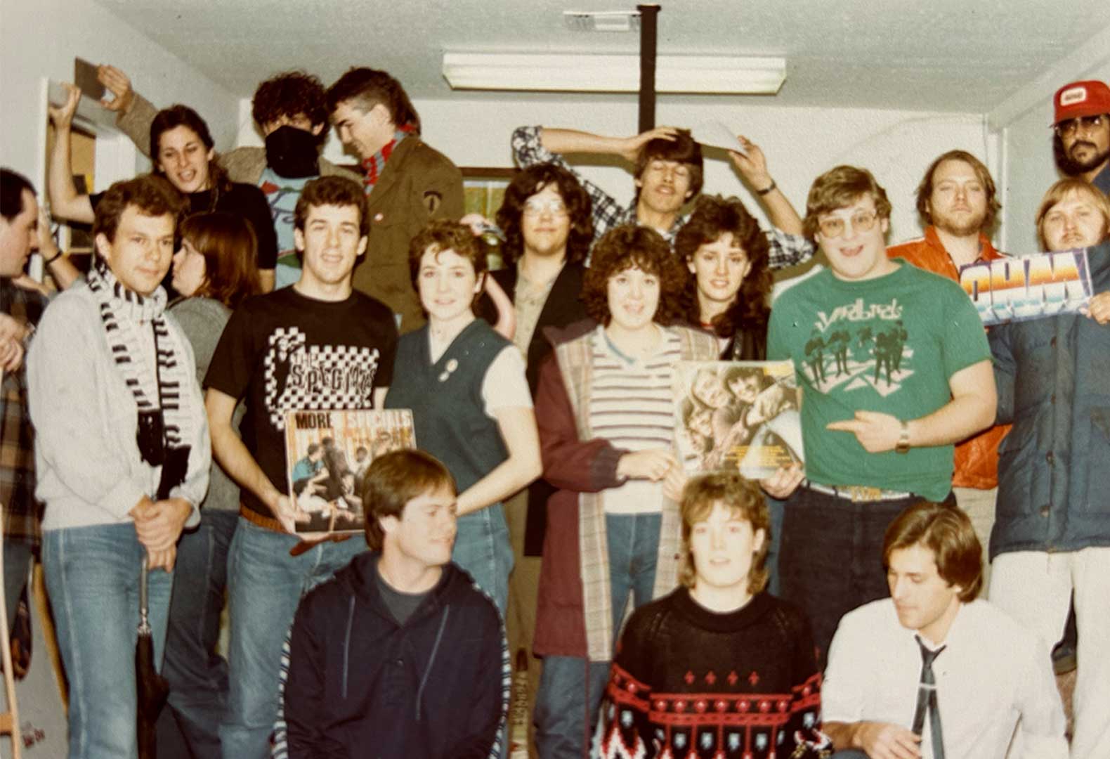 A photograph taken in 1981 featuring student employees at the on-campus radio station, KCSC.