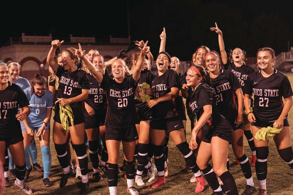 Members of the 2023 Chico State women's soccer team celebrate a victory.