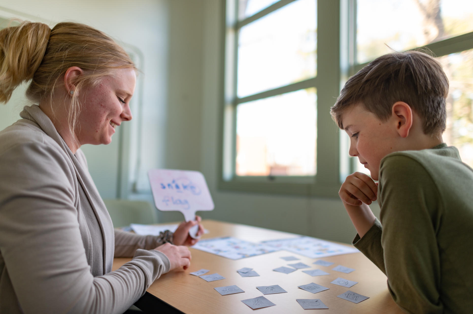 Alyssa DeVries (left) and Liam McCoy (right) work on an exercise during a Communication for Disorders (CCD) counseling session on at Chico State.
