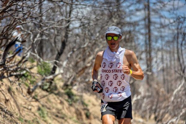 Anthony Costales runs during the 2023 Western States 100 while donning his Chico State cross country jersey.