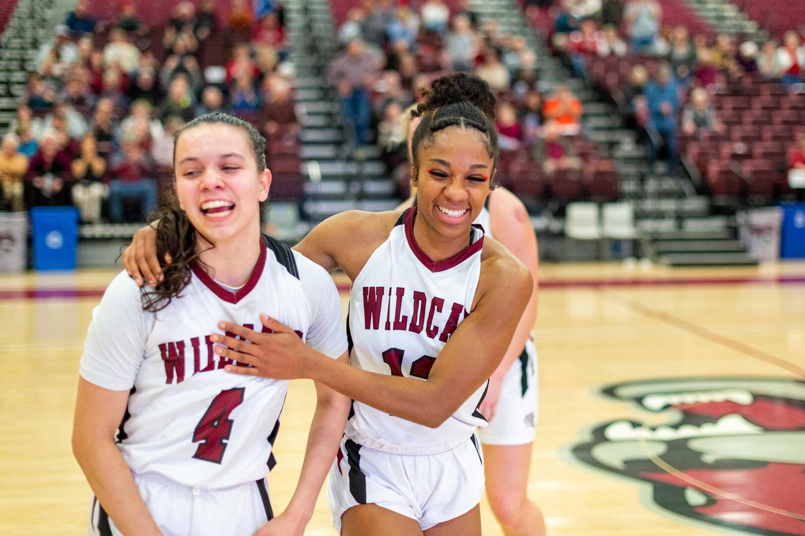 Chico State’s #4 Brandy Huffhines (left) and #12 Zhane Duckett (right) flash big smiles as they celebrate after the Wildcats’ victory over Cal State Dominguez Hills.