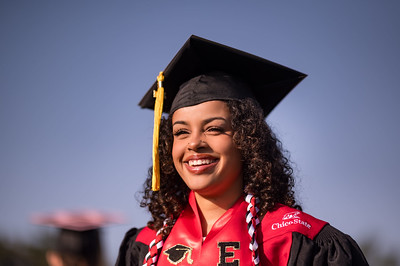 A student smiles during the College of Behavioral and Social Sciences Commencement Ceremony.
