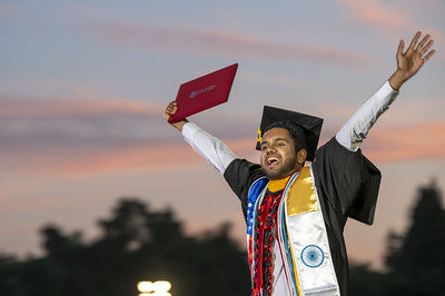 Photo of a student during the College of Behavioral and Social Sciences and College of Business Graduation Ceremony.