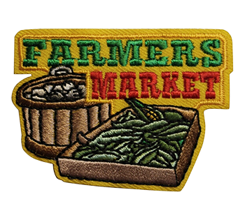 A patch with the words farmers market and baskets of vegetables.
