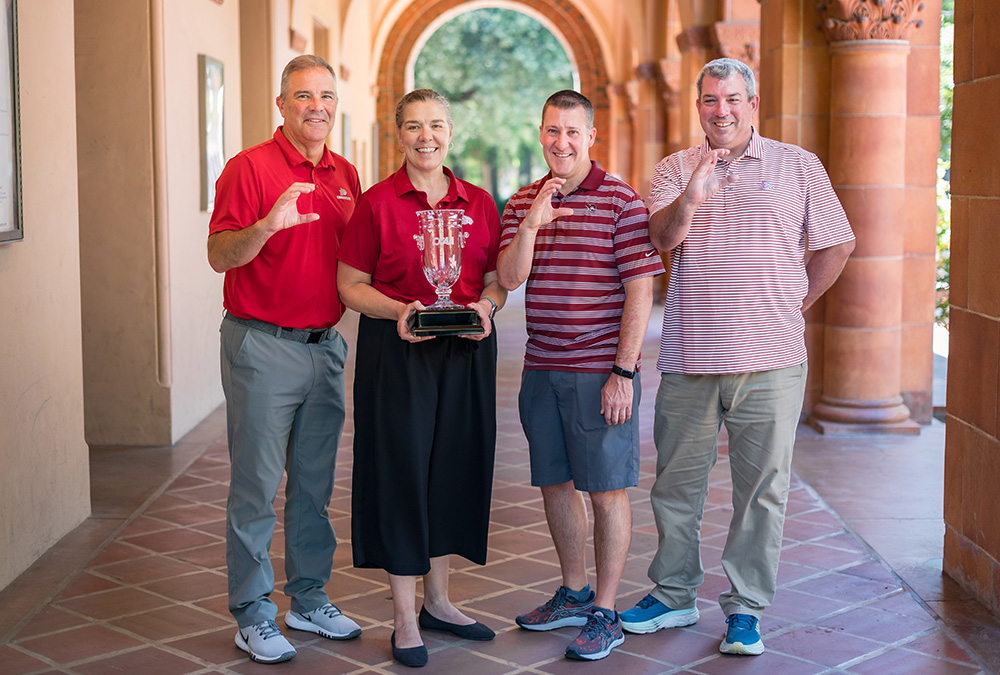 President Steve Perez, Executive Athletic Director Anita Barker, Assistant Athletic Director Brian Ceccon, and Faculty Athletic Representative Matt Thomas (left to right) take a group photo as the California Collegiate Athletic Association (CCAA) awarded Chico State Intercollegiate Athletics with the 2023-24 Robert J. Hiegert Commissioner's Cup.