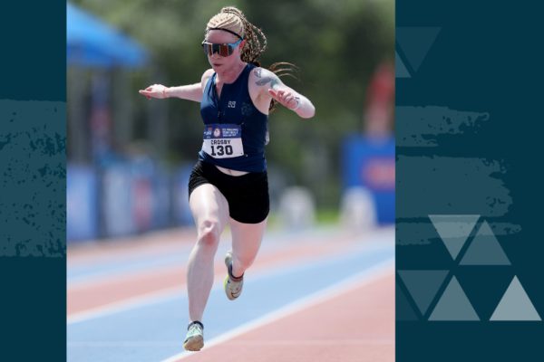 Kym Crosby runs across the finish line during the 100 meter race while competing for team USA during the 2020 Paralympic Games.