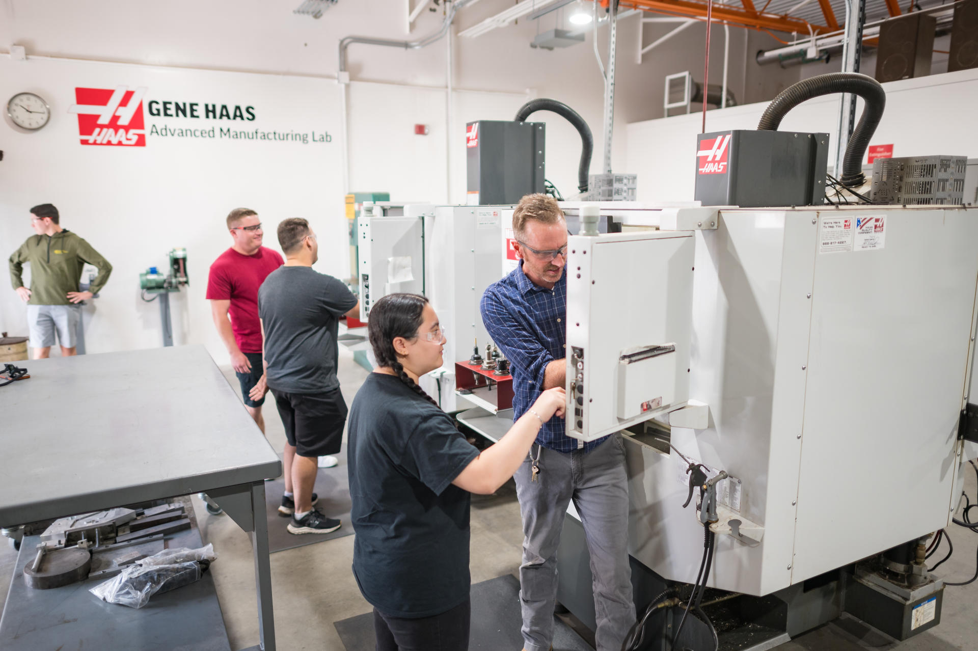 Students work with the computer numerical control machines in the Gene Haas Lab.